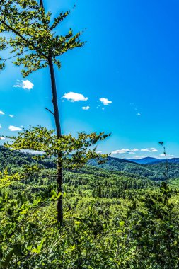 view of the green mountains and blue sky