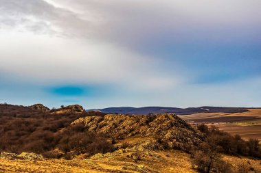 a beautiful shot of a mountain in the background