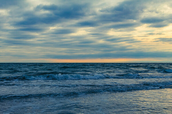 dramatic sunset on the baltic sea coast, latvia