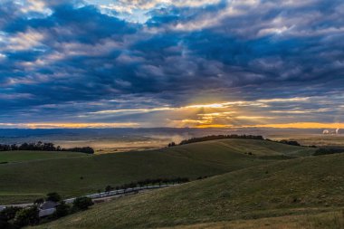 the sunset at the top of the mountain