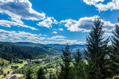 beautiful view from the top of mountain with forest and clouds