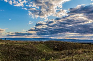 beautiful sunset over a field in the mountains