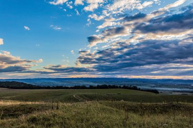 view from a high hill with the blue sky