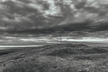 a grayscale shot of the hills in the countryside