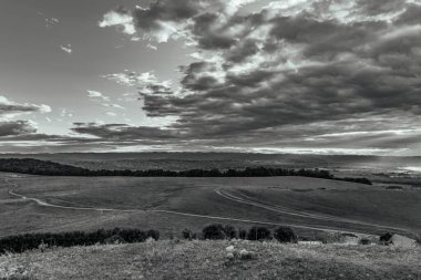 a beautiful shot of a hills with a cloudy sky