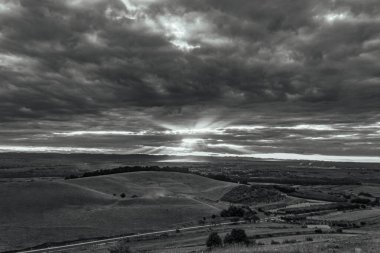the sun sets in the mountains of italy