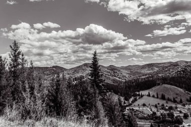 view of a beautiful landscape with mountain range on a sunny day in the colorado