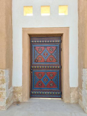 Close-Up of aTraditional Ornate Painted Door in Diriyah, Saudi Arabia clipart