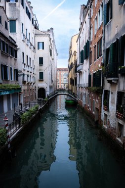 Venice Italy Canal, No boats or people are seen and sky is partially cloudy clipart