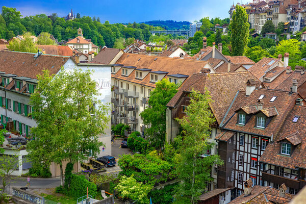 May 30, 2023, Bern, Switzerland. Residential buildings in the historic center of Bern by the Aare River. High quality photo