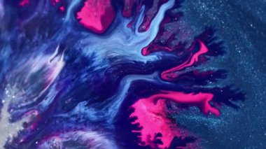 Dönen sıvı boya. Parıldayan duman. Çok renkli parçacıklar. Yaratıcı soyut sanat arkaplanı.