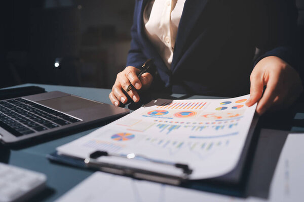 Expert woman asian female people review data number costing managerial account prepare monthly actual cost variance report at tax audit office. ESG sheet budget control ERP process service project.