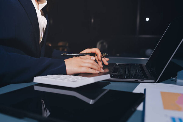 Expert woman asian female people review data number costing managerial account prepare monthly actual cost variance report at tax audit office. ESG sheet budget control ERP process service project.