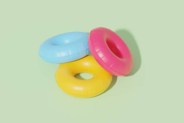 Inflatable swim tubes in pastel background, 3d rendering. Swimming rings in bright colours, concept of summer, holidays and sea vacation