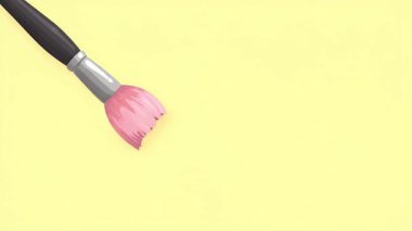 Pembe boyalı bir boya fırçası, sanat ve tasarım projeleri için mükemmel sarı arka planda canlı bir hareket yaratır..