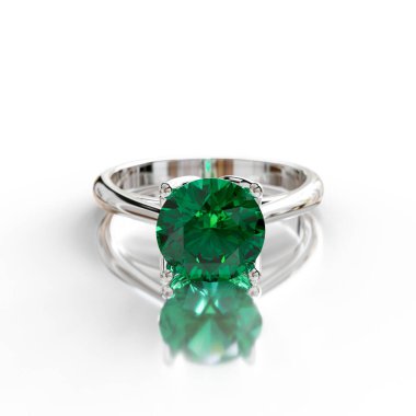 Zengin yeşil zümrüdü olan zarif, beyaz altın bir solitaire yüzük, sofistike bir görünüm için zarif bir şekilde dört perdelik bir ayara ayarlanmış. Lüks ve doğanın sembolü..