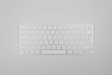Açık gri arkaplanda beyaz klavyenin üst görünümü. Modern ofis yatağı, kopyalama alanı.
