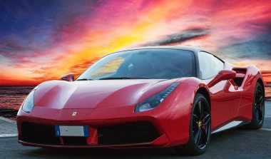 Luxury model fast sports car Ferrari 488 GTB placed on a scenic sunset background,Rome, Italy  February 20,2023 clipart