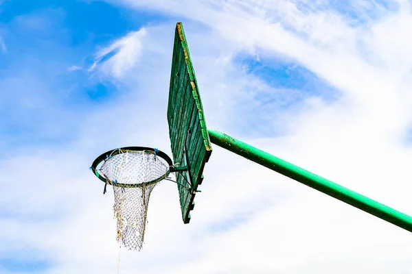 Photography on theme old basketball hoop of net basket on background natural sky, photo consisting from old basketball hoop in net basket, old basketball hoop of net basket this countryside no people