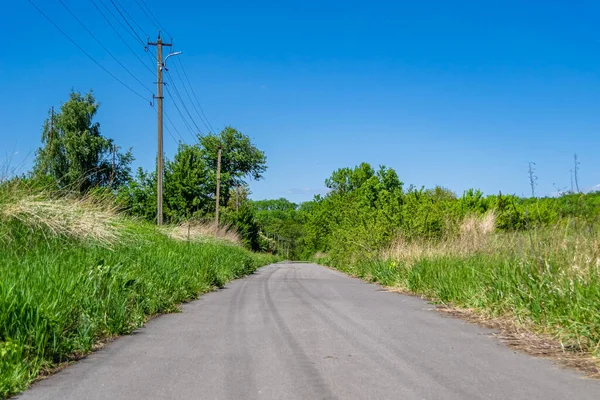 stock image Beautiful empty asphalt road in countryside on colored background, photography consisting of new empty asphalt road passing through countryside, empty asphalt road for speed car in foliage countryside