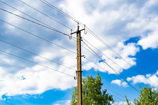 Power electric pole with line wire on colored background close up, photography consisting of power electric pole with line wire under sky, line wire in power electric pole for residential buildings