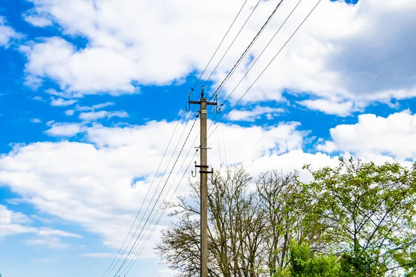 Power electric pole with line wire on colored background close up, photography consisting of power electric pole with line wire under sky, line wire in power electric pole for residential buildings