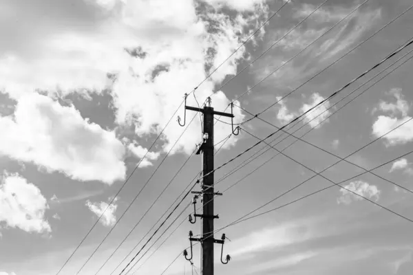 stock image Power electric pole with line wire on light background close up, photography consisting of power electric pole with line wire under sky, line wire in power electric pole for residential buildings