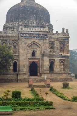 Ancient Mughal-era Shisha Gumbad monument in Lodi Gardens, Delhi, India. Featuring domed architecture, stone carvings, and historic Islamic design, a symbol of Indias medieval heritage.