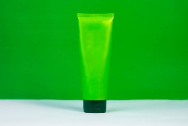 Eco-friendly green hand cream tube mockup, perfect for natural skincare brands. Set on a clean white or green background.