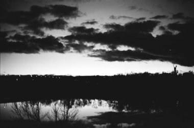 Motherland monument. Kyiv, Ukraine, sunset sky, black and white photo. 35mm analog film photo 