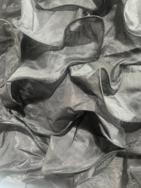 Grey chiffon fabric with a wavy texture can be used for the background 