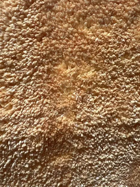 Yumuşak, yumuşacık, kahverengi kumaş, evin ön kapısı için bir paspas..