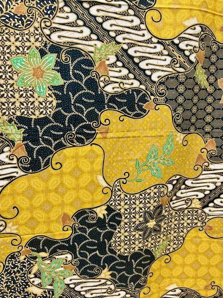 Solo, Endonezya 'dan soyut, çiçek ve yaprak motifli güzel geleneksel Endonezya batik kumaşı. Tekstil, pamuk kumaşlar, kapaklar, duvar kâğıdı, baskı, kartlar, hatıra defteri