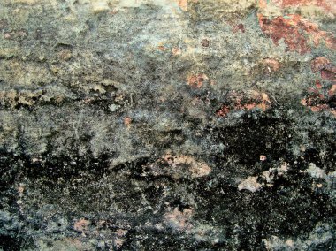 Eski duvarın arkasında bir taş deseni var.