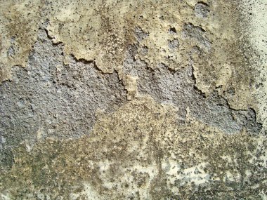 Eski duvarın arkasında bir taş deseni var.