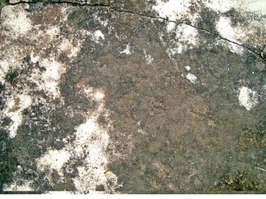 Eski duvarın arkasında bir taş deseni var.