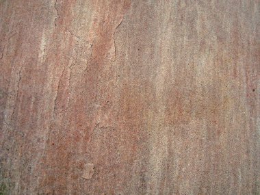 Eski duvarın arkasında bir taş deseni var.