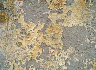 Eski duvarın arkasında bir taş deseni var.