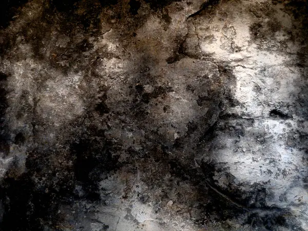 Eski duvarın arkasında bir taş deseni var.