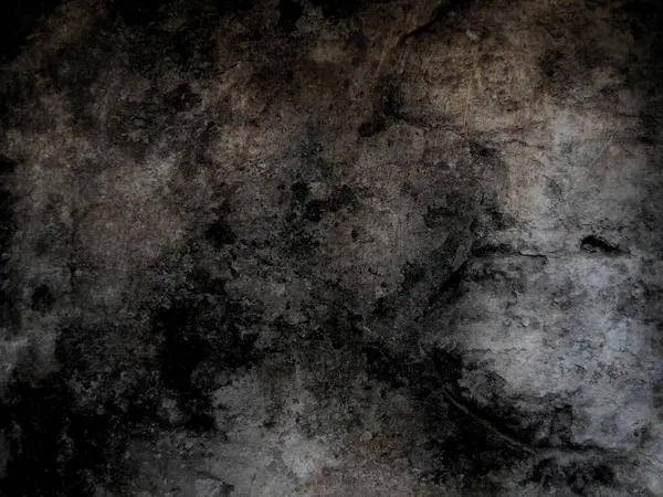 Eski duvarın arkasında bir taş deseni var.