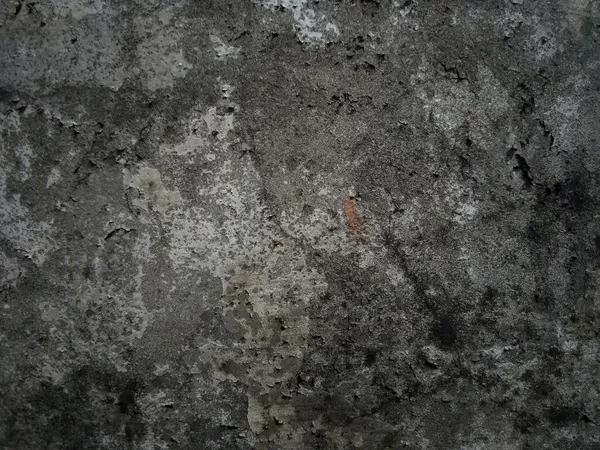 Eski duvarın arkasında bir taş deseni var.