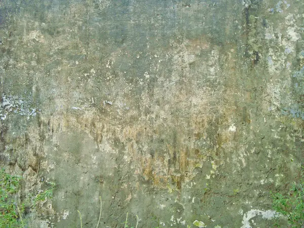 Eski duvarın arkasında bir taş deseni var.