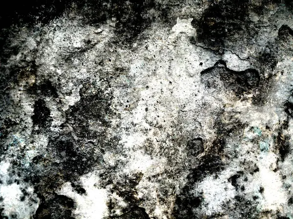 Eski duvarın arkasında bir taş deseni var.