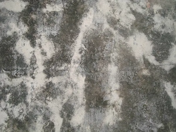 Eski duvarın arkasında bir taş deseni var.