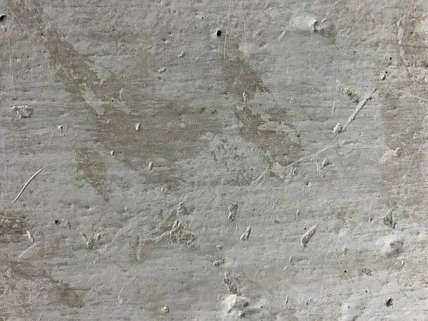 Beyaz arka planı olan gri beton bir duvar. gri doku.