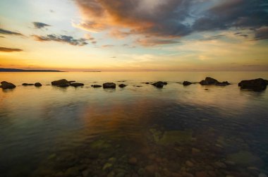 View of the rocks in the sea at dusk. Alor, East Nusa Tenggara, Indonesia