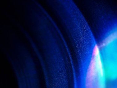 Dairesel tasarım kalıpları ve tanecikli detaylarıyla soyut ışık gradyanı.