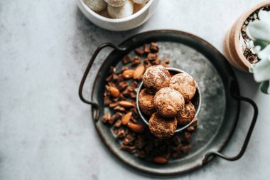 Beautiful and delicious homemade cocoa dusted chocolate truffles with dark chocolate in a retro grunge style.