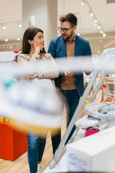 Attractive Middle Age Couple Enjoying Buying Clothes Appliances New Baby — Stock fotografie