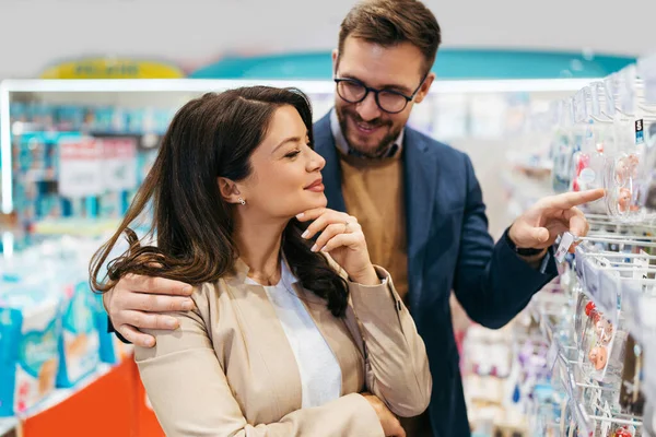 Attractive Middle Age Couple Enjoying Buying Clothes Appliances New Baby — Stock Fotó